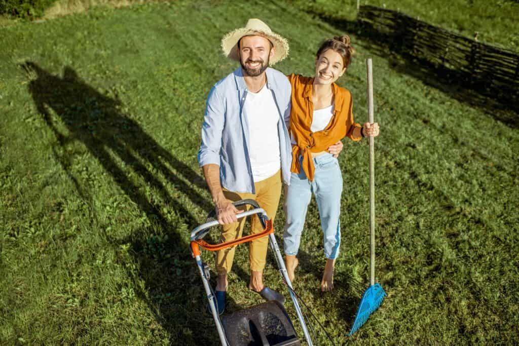 November 6, 2025 Man And Woman Cleaning Green Lawn