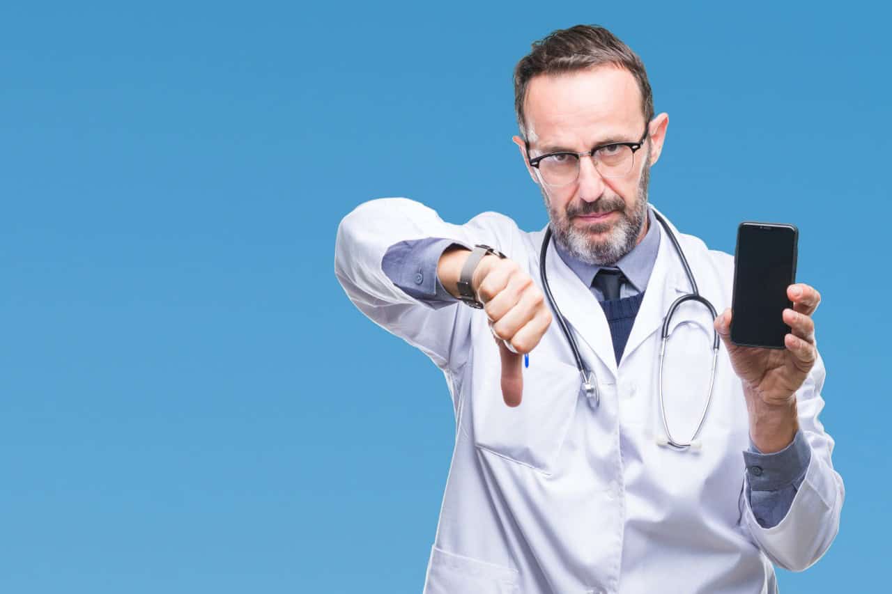 Healthcare professionals collaborating on digital workflow tools